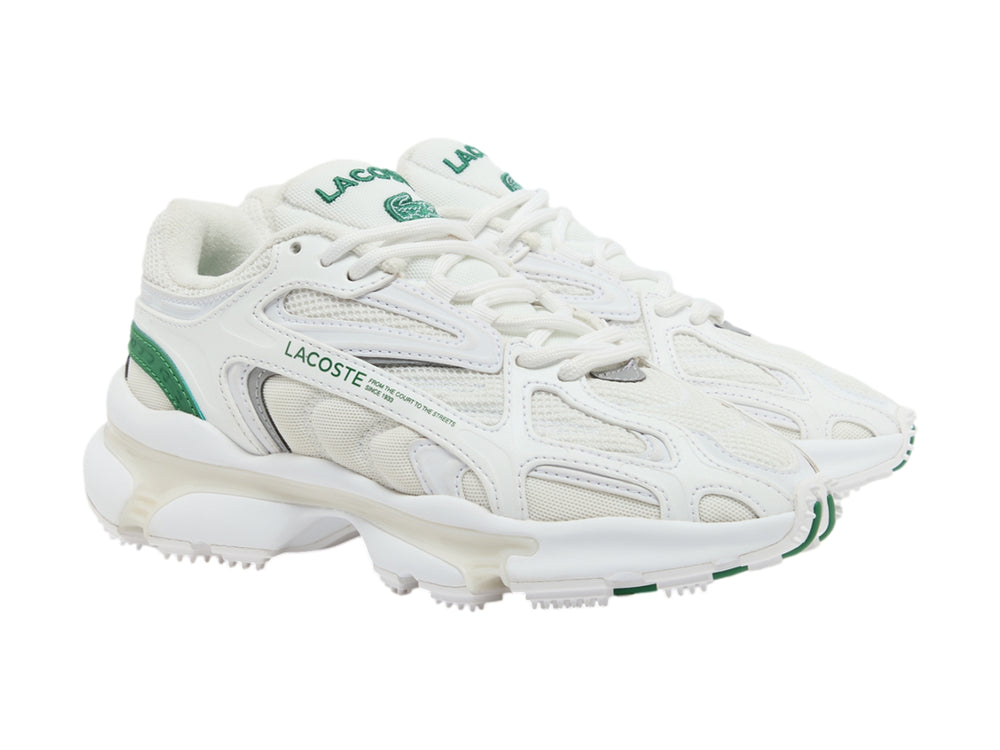 Tenis deportivos Lacoste blancos con detalles en verde y suela gruesa.