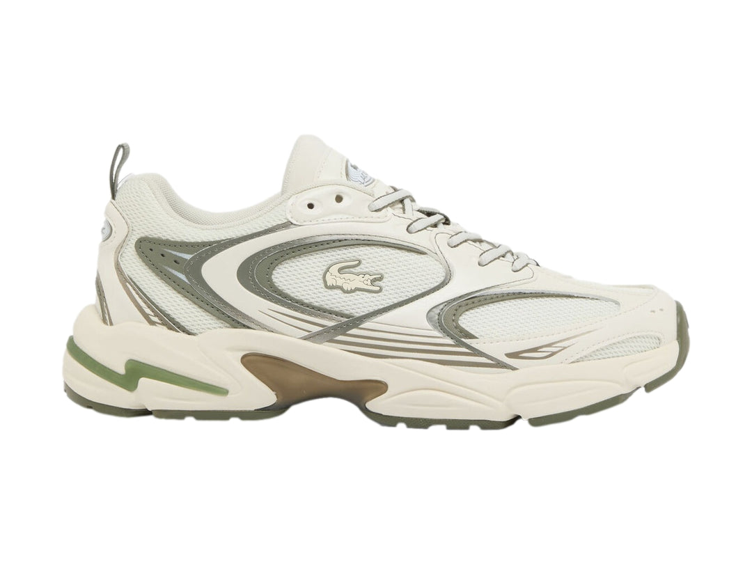 Tenis deportivos Lacoste en color blanco roto y caqui con suela gruesa y diseño chunky.