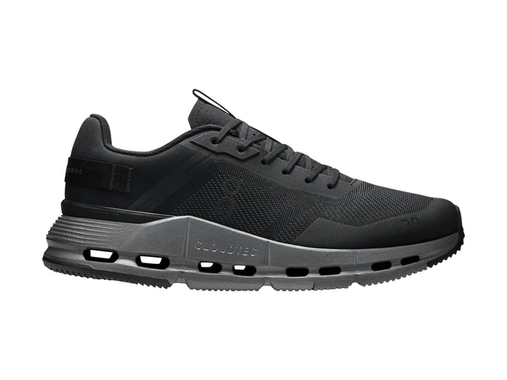 Tenis deportivos On Cloud en color negro y gris oscuro con suela tecnológica.