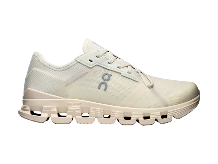 Tenis deportivos On Cloud color blanco hueso con suela amortiguada y diseño moderno.
