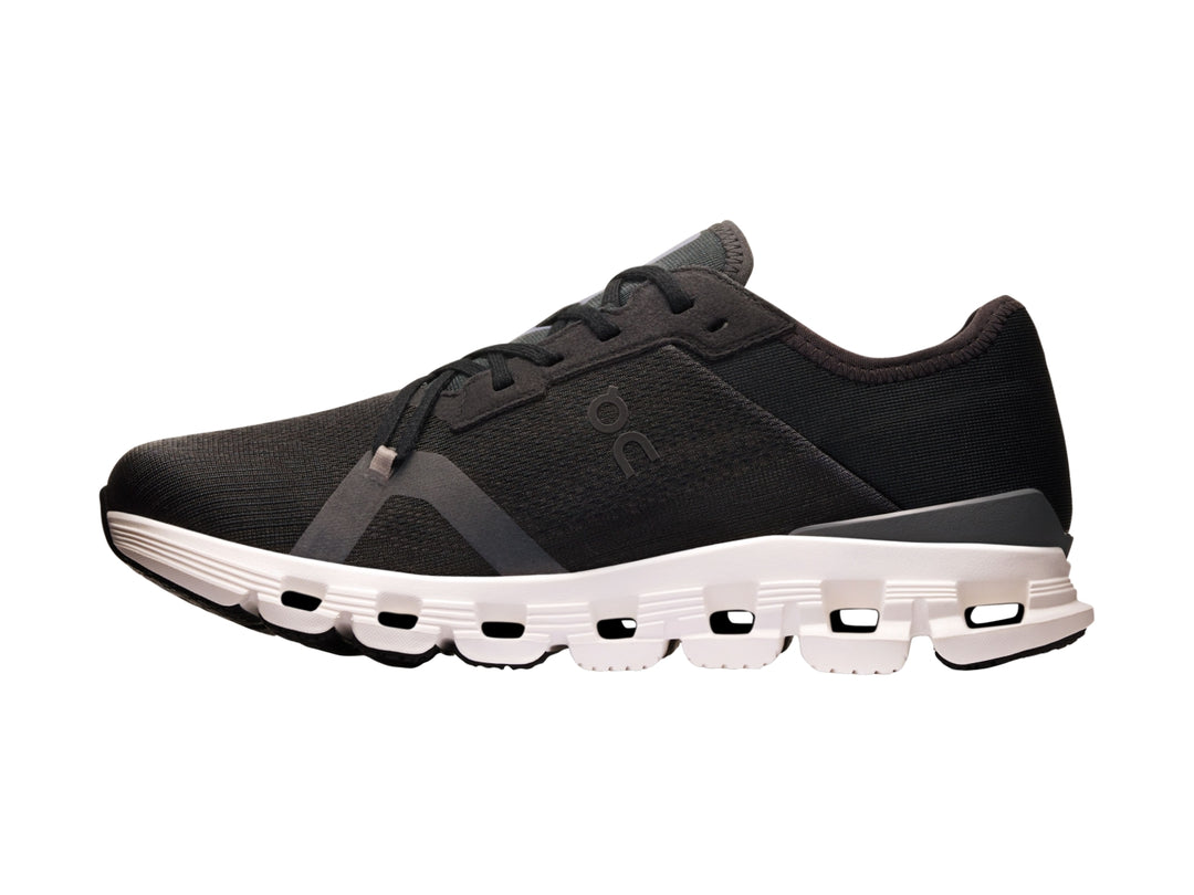 Tenis deportivos On Cloud color negro con suela blanca y diseño de amortiguación CloudTec.