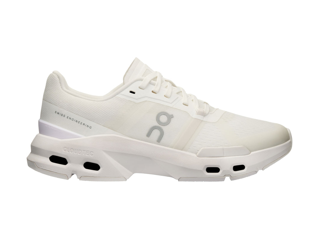 Tenis deportivos On Cloud en color blanco y gris claro con suela tecnológicay diseño moderno.