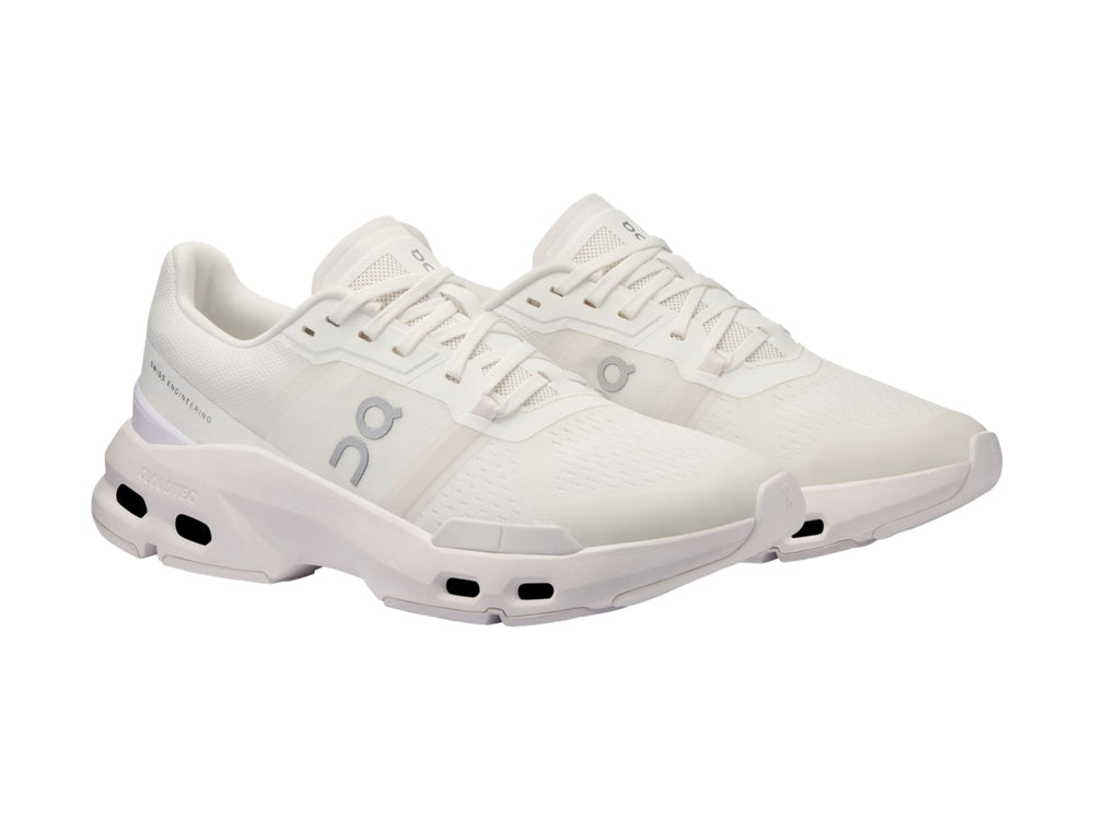 Tenis deportivos On Cloud en color blanco y gris claro con suela tecnológicay diseño moderno.
