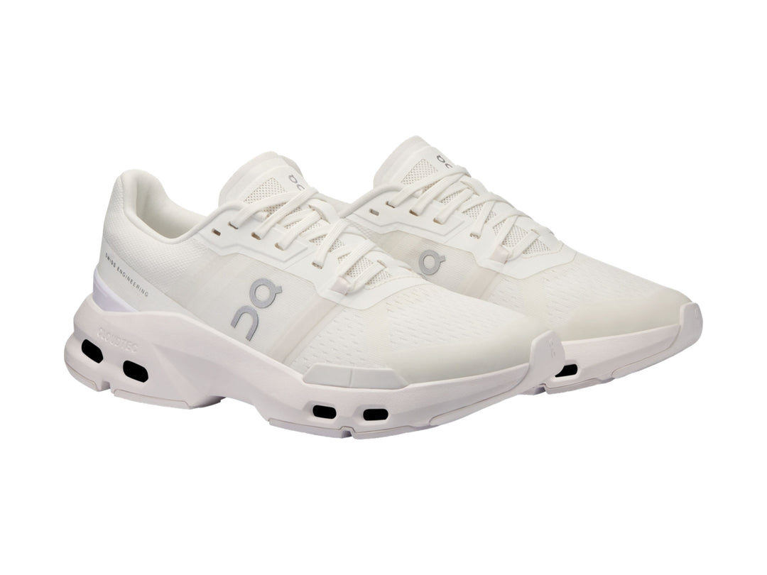 Tenis deportivos On Cloud en color blanco y gris claro con suela tecnológicay diseño moderno.
