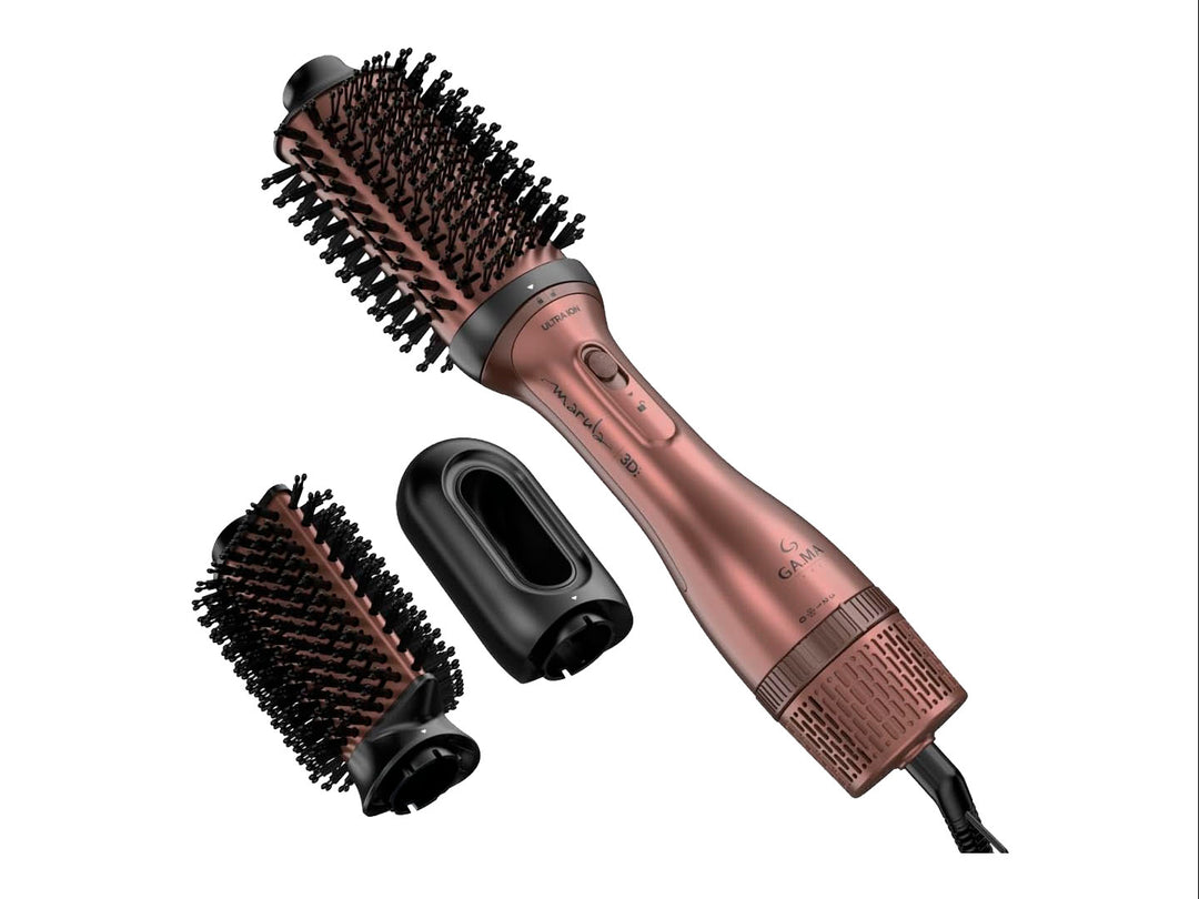 Cepillo moldeador de cabello GAMA ITALY en color rosa con accesorios y cabezal intercambiable sobre fondo blanco.