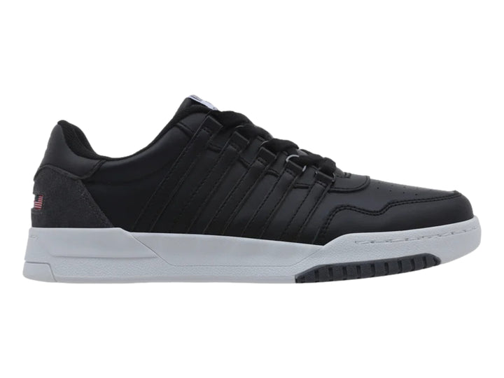 Tenis K-Swiss color negro con suela blanca y detalle en gris en el talón, vista lateral.