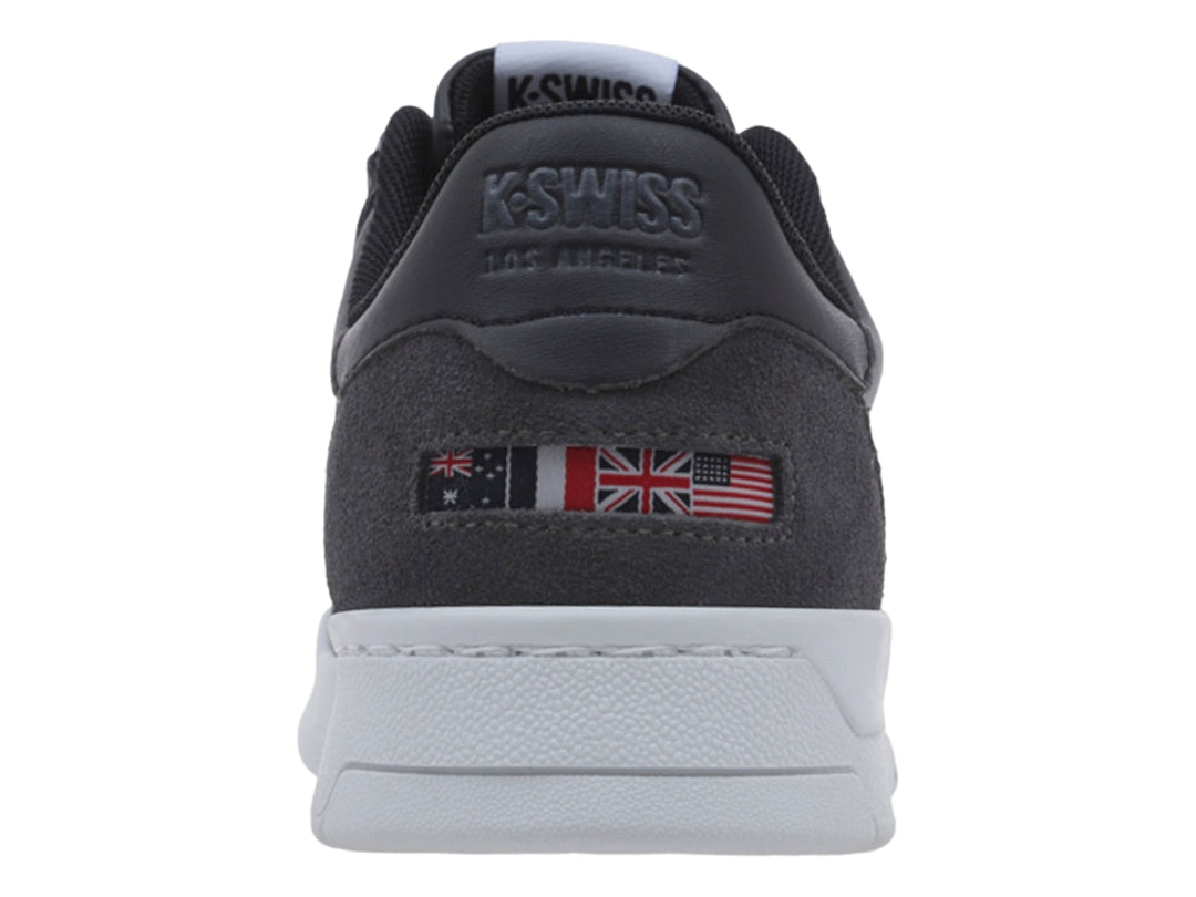 Tenis K-Swiss color negro con suela blanca y detalle en gris en el talón, vista lateral.