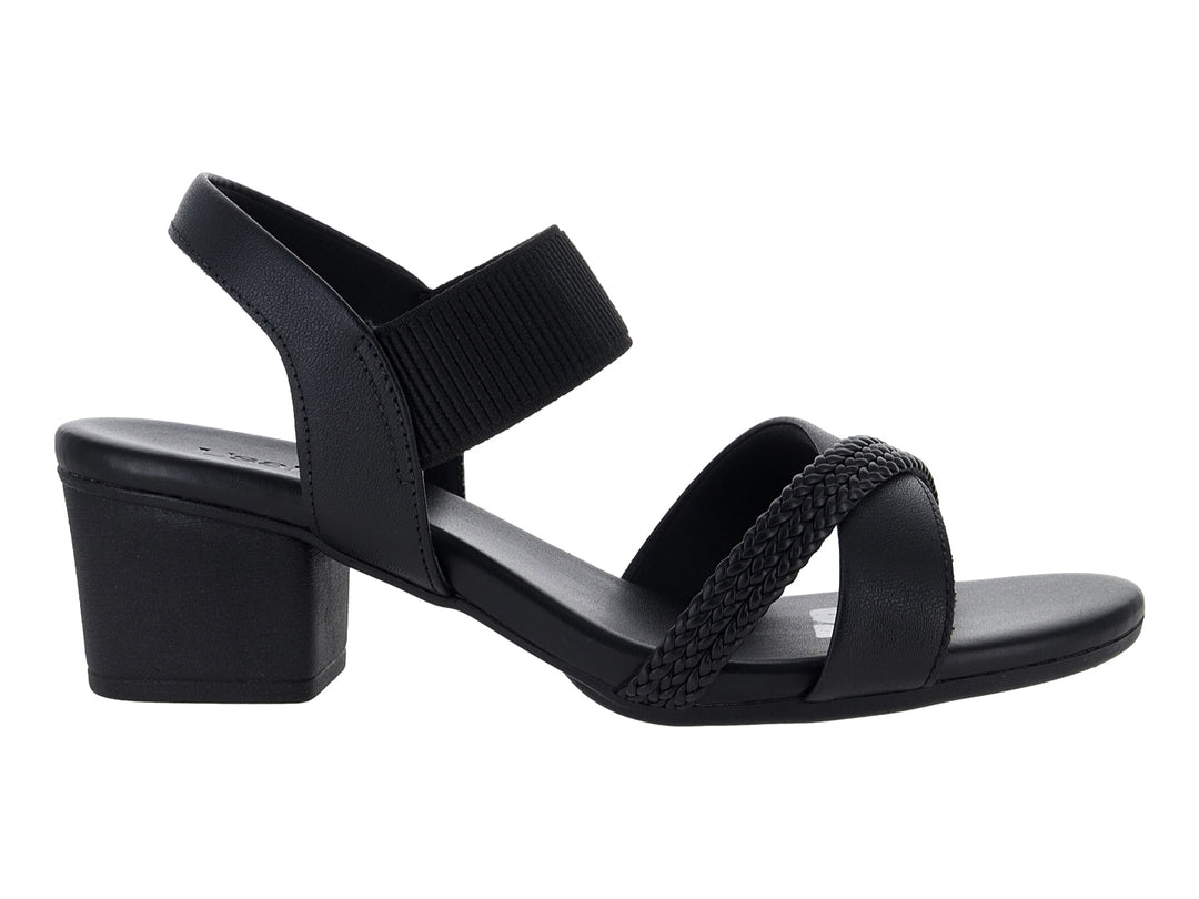 Sandalias negras Usaflex con tacón cuadrado, correa al tobillo y detalle trenzado frontal.