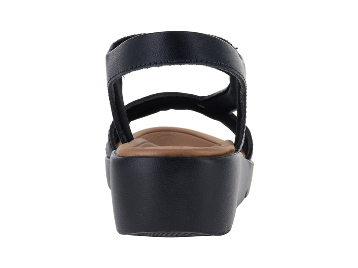 Sandalia de plataforma color negro para mujer con plantilla marrón y correa.