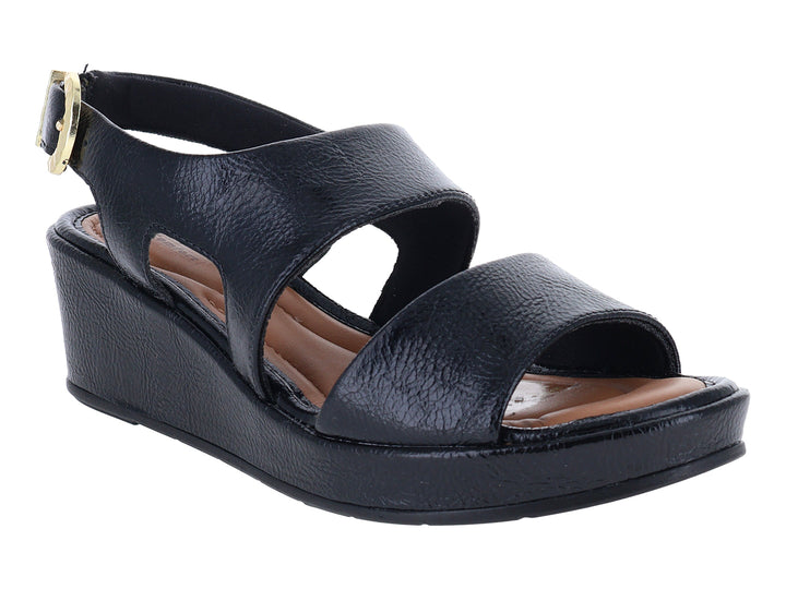 Sandalia negra de plataforma con hebilla dorada y suela cuña para Mujer.