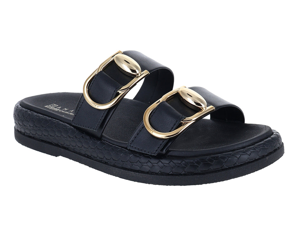Sandalias negras de plataforma con hebillas doradas y detalle trenzado en la suela.