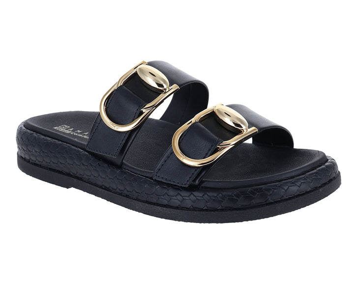 Sandalias negras de plataforma con hebillas doradas y detalle trenzado en la suela.