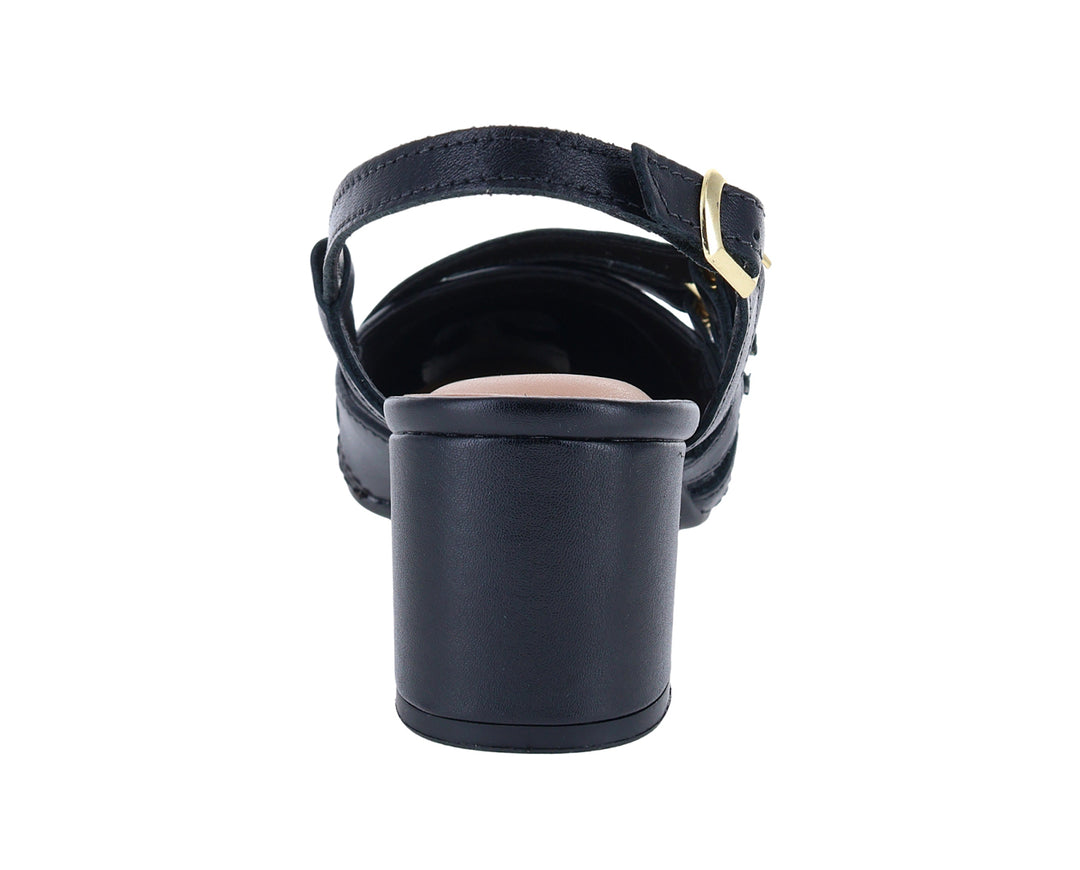 Zapato negro para mujer de tacón cuadrado con correas y hebillas doradas.