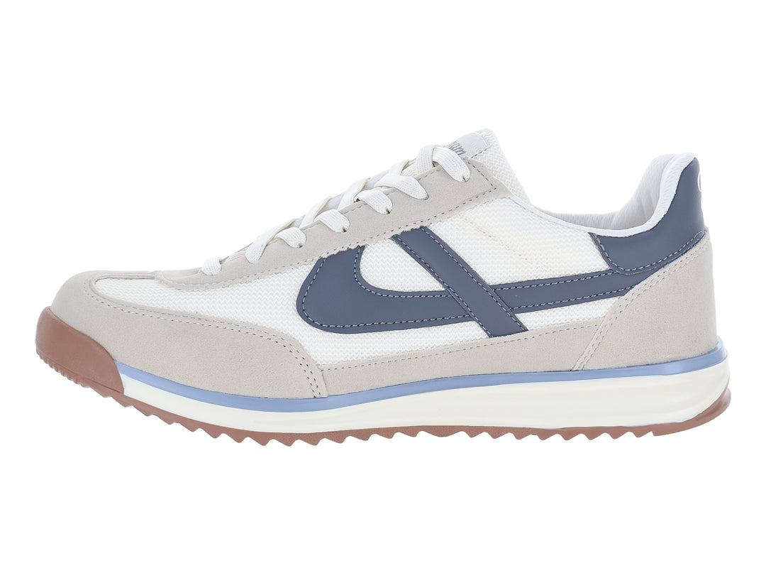 Tenis Panam color latte gris y blanco con detalles azules y suela color café.