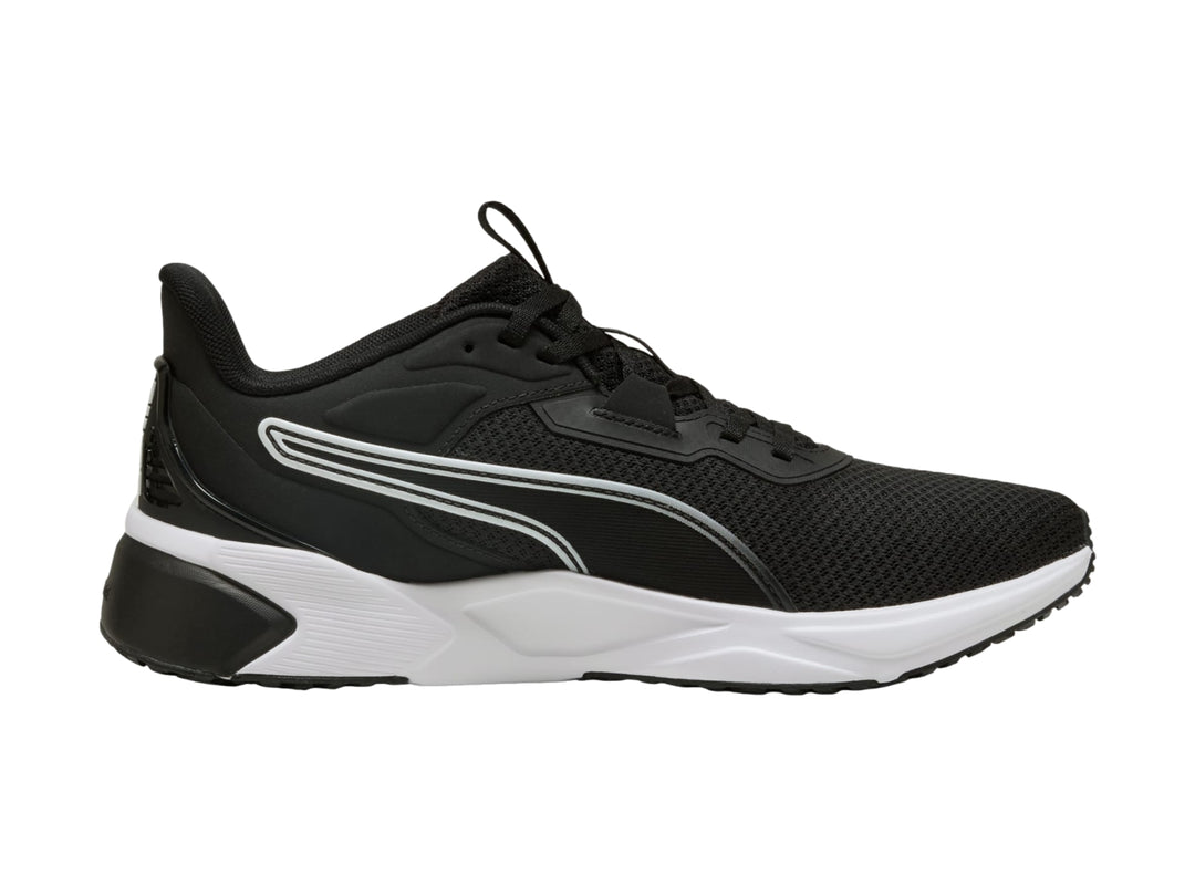 Tenis deportivos PUMA color negro con suela blanca y detalles en malla.