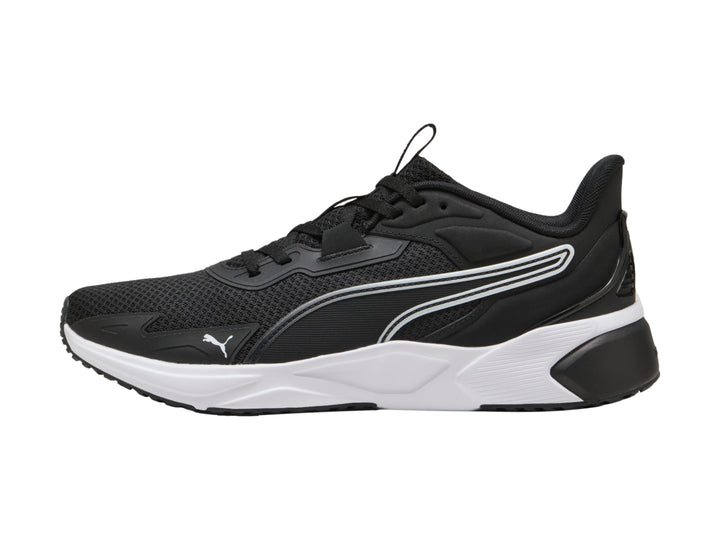 Tenis deportivos PUMA color negro con suela blanca y detalles en malla.