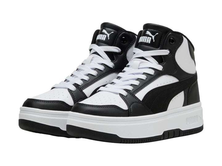Tenis PUMA Rebound Femme Mid en colores blanco y negro con suela de plataforma blanca.