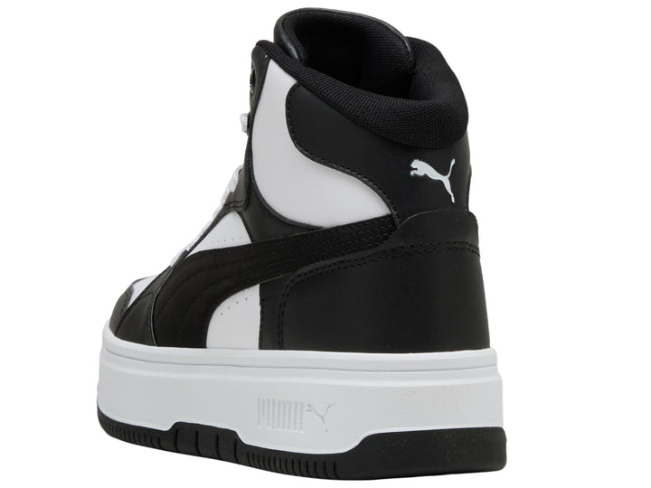 Tenis PUMA Rebound Femme Mid en colores blanco y negro con suela de plataforma blanca.