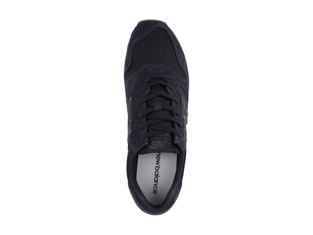 Tenis New Balance modelo 373 en color negro con acabados en gamuza y malla.