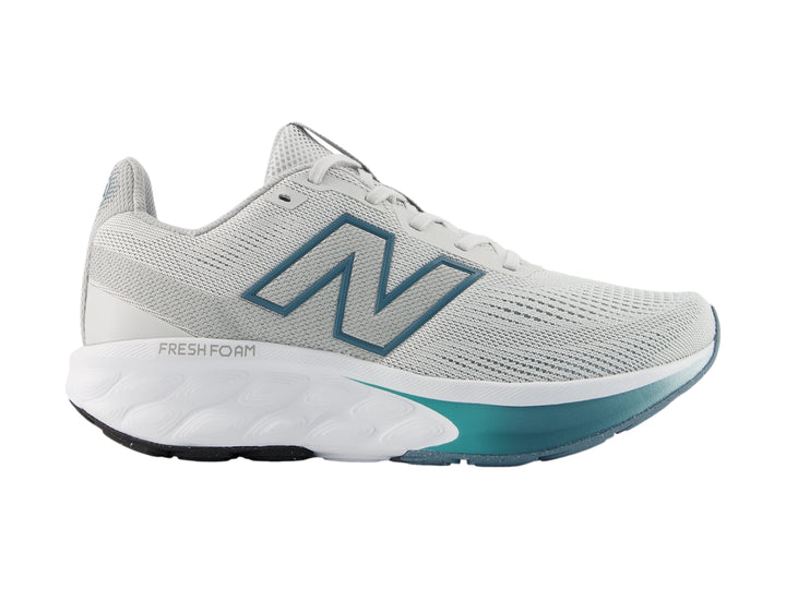 Tenis New Balance 520 color gris con suela blanca y detalles en azul para hombre