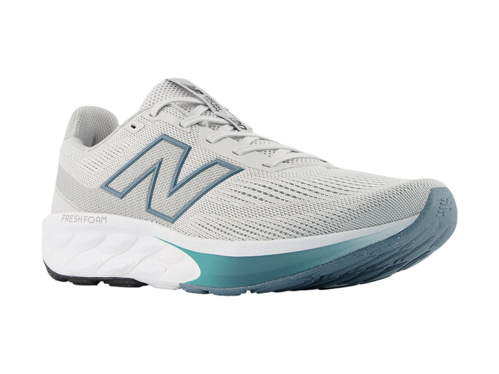 Tenis New Balance 520 color gris con suela blanca y detalles en azul para hombre