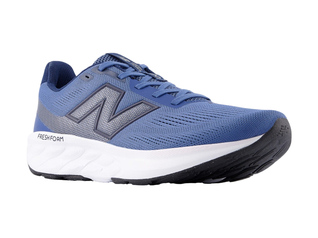 Tenis New Balance 520 color azul con suela blanca para hombre.