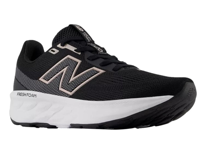 Tenis New Balance modelo 520 en color negro con suela blanca y detalles en rosa, vista lateral.
