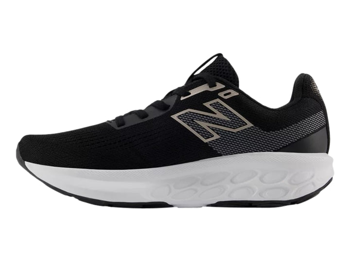 Tenis New Balance modelo 520 en color negro con suela blanca y detalles en rosa, vista lateral.