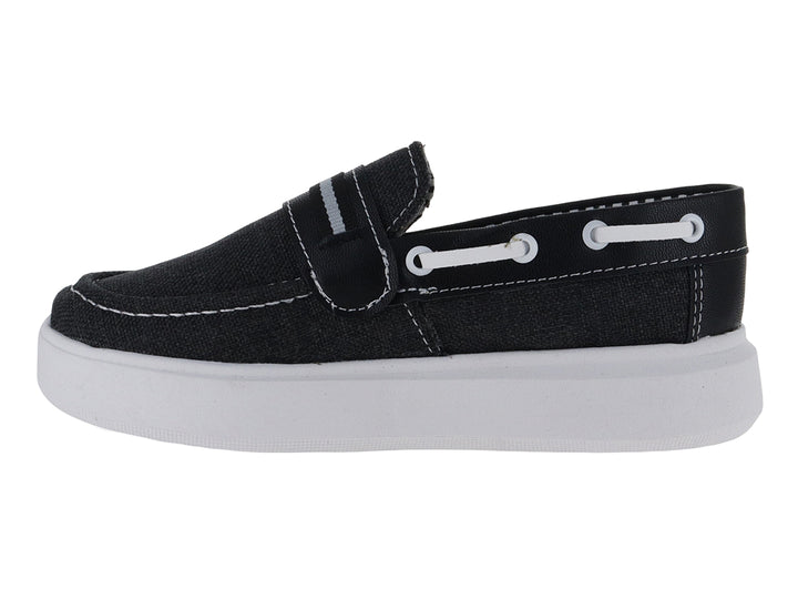 Zapato tipo mocasín de lona color negro con suela blanca para niño.