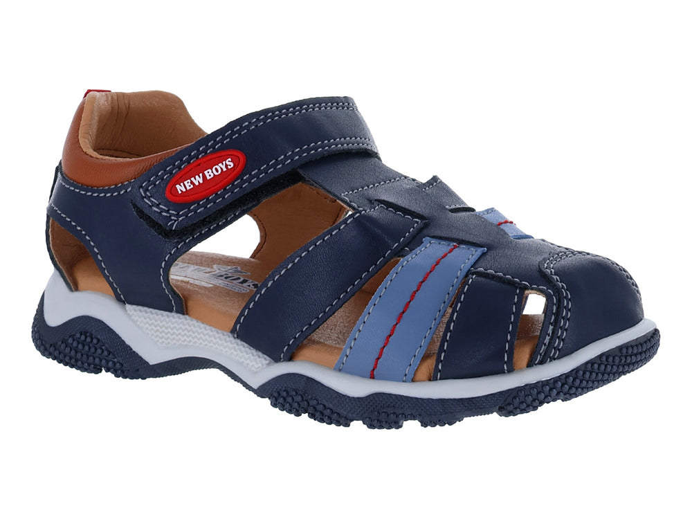 Sandalia para niño color azul marino con suela blanca y detalles en café y azul claro.