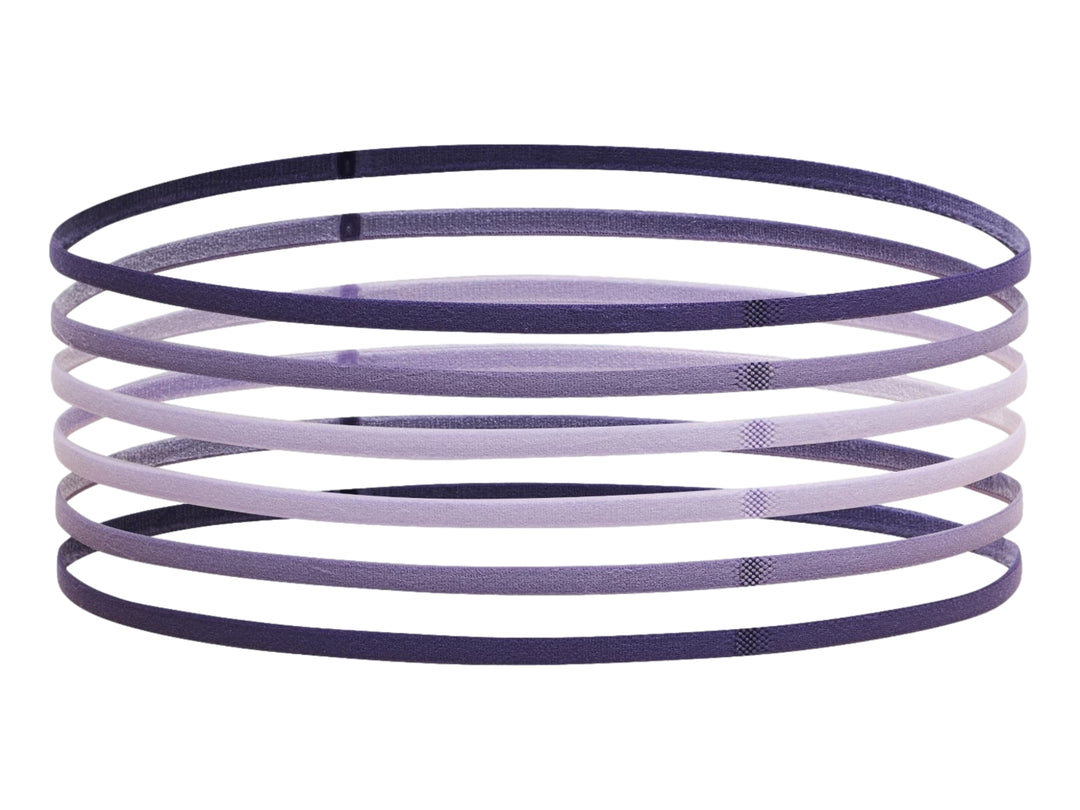 Set de 6 bandas elásticas de resistencia Under Armour en diferentes tonalidades de morado y lila.