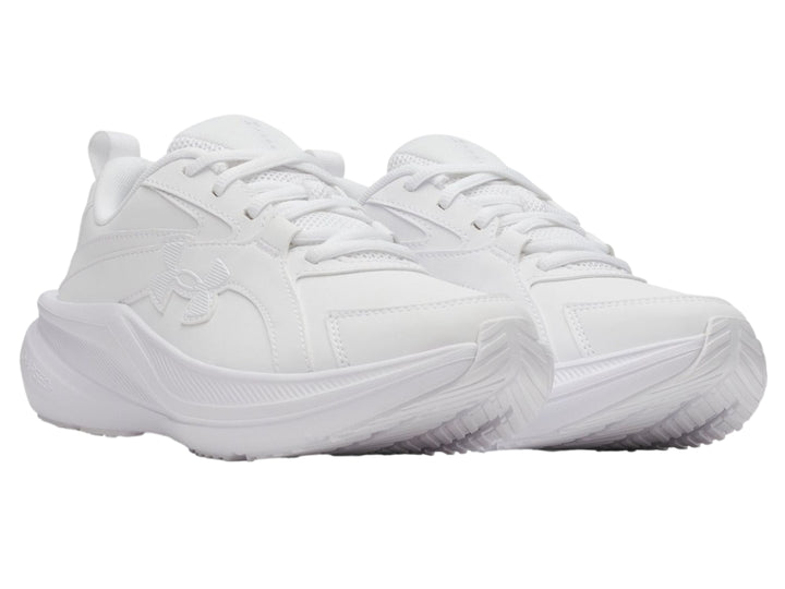 Tenis deportivos Under Armour color blanco para niño con suela robusta y cierre de cordones.