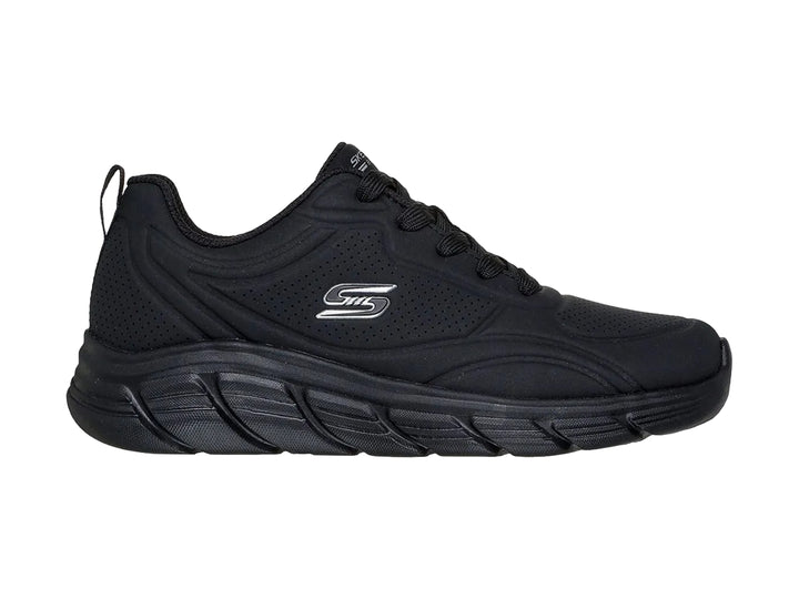 Tenis deportivos Skechers color negro con suela gruesa y cordones.
