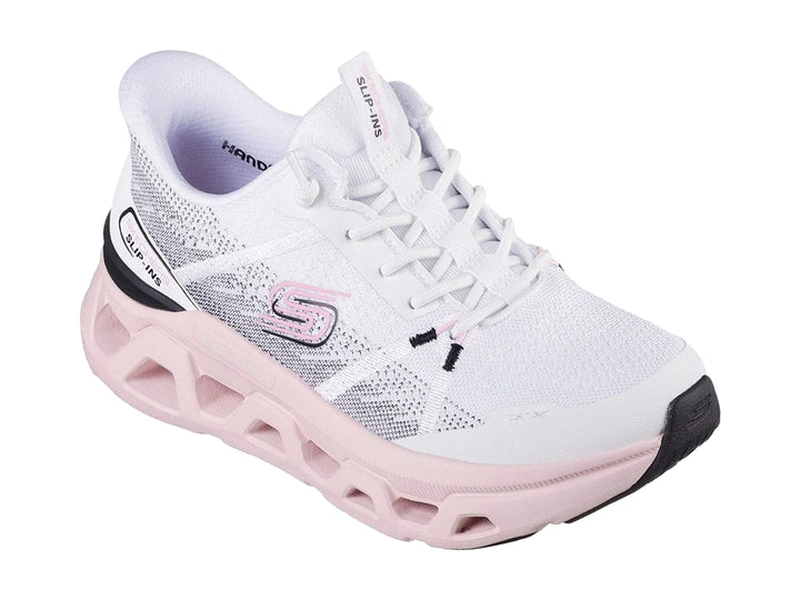Tenis deportivos Skechers blancos con suela gruesa en color rosa claro y detalles en negro.