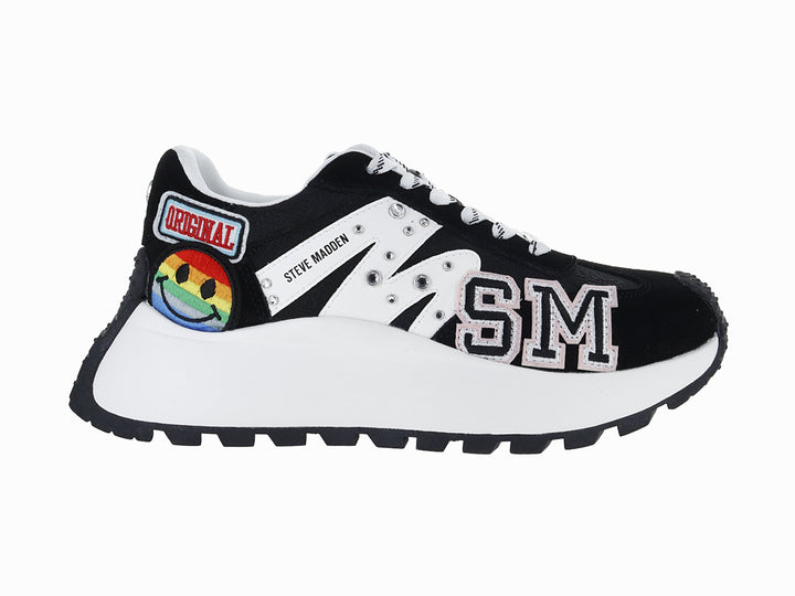Tenis Steve Madden color negro y blanco con detalles coloridos y suela gruesa blanca.