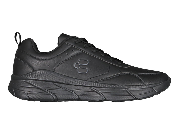 Tenis deportivos Charly color negro con suela gruesa y acabado mate.