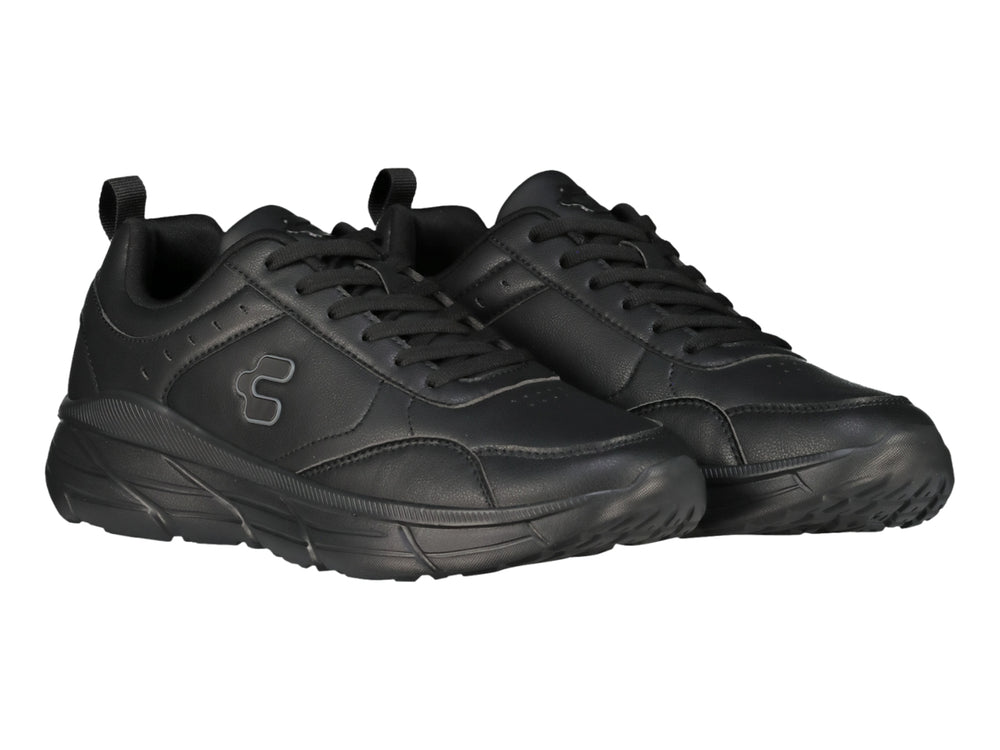 Tenis deportivos Charly color negro con suela gruesa y acabado mate.