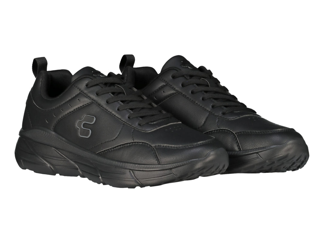 Tenis deportivos Charly color negro con suela gruesa y acabado mate.