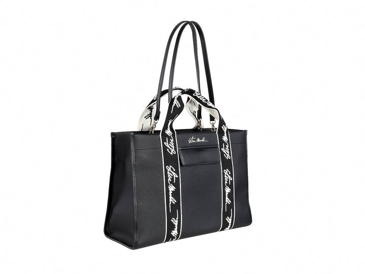 Bolso tote negro Steve Madden con bandas verticales blancas y asas largas coordinadas.