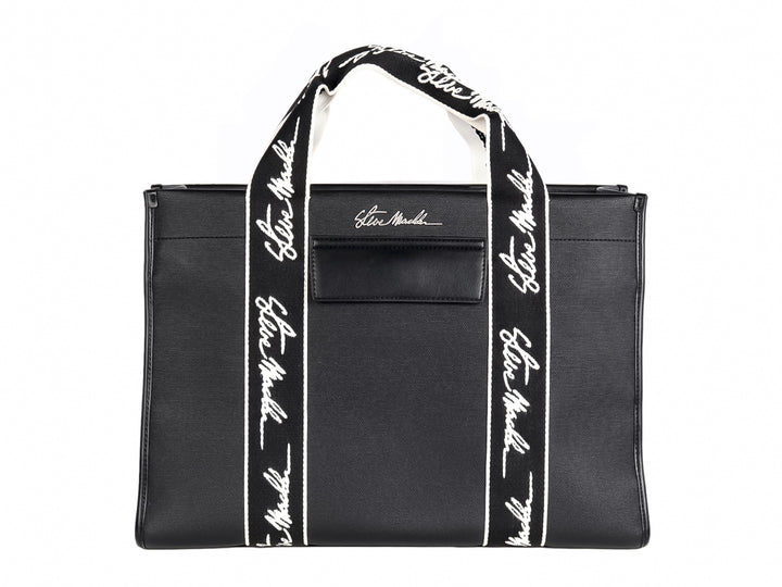 Bolso tote negro Steve Madden con bandas verticales blancas y asas largas coordinadas.