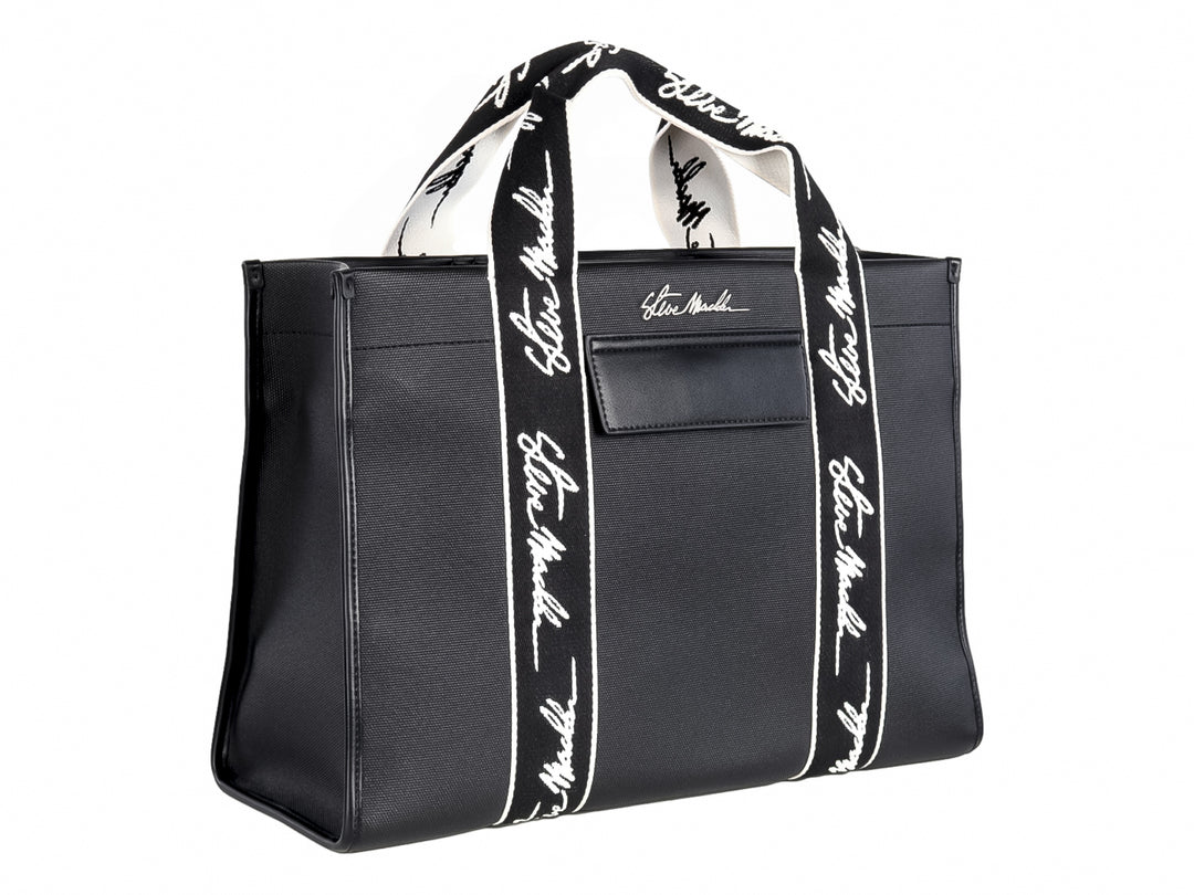 Bolso tote negro Steve Madden con bandas verticales blancas y asas largas coordinadas.