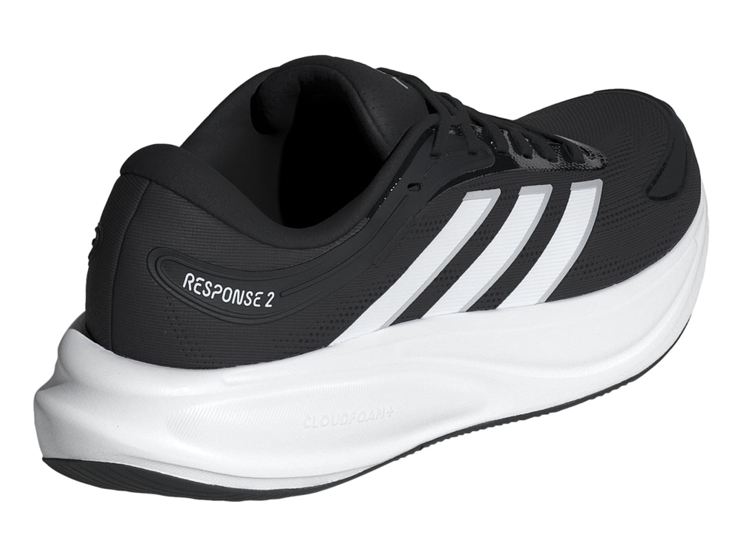 Tenis deportivos Adidas Response 2 en color negro con suela blanca y franjas laterales blancas.