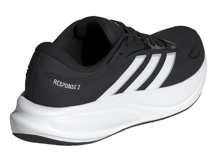 Tenis deportivos Adidas Response 2 en color negro con suela blanca y franjas laterales blancas.