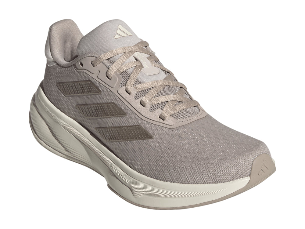 Tenis deportivos Adidas Response Super en color taupe con suela blanca y tejido transpirable.