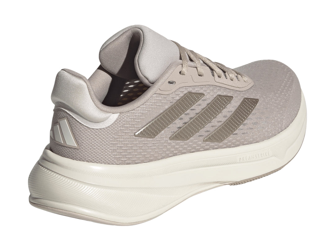 Tenis deportivos Adidas Response Super en color taupe con suela blanca y tejido transpirable.