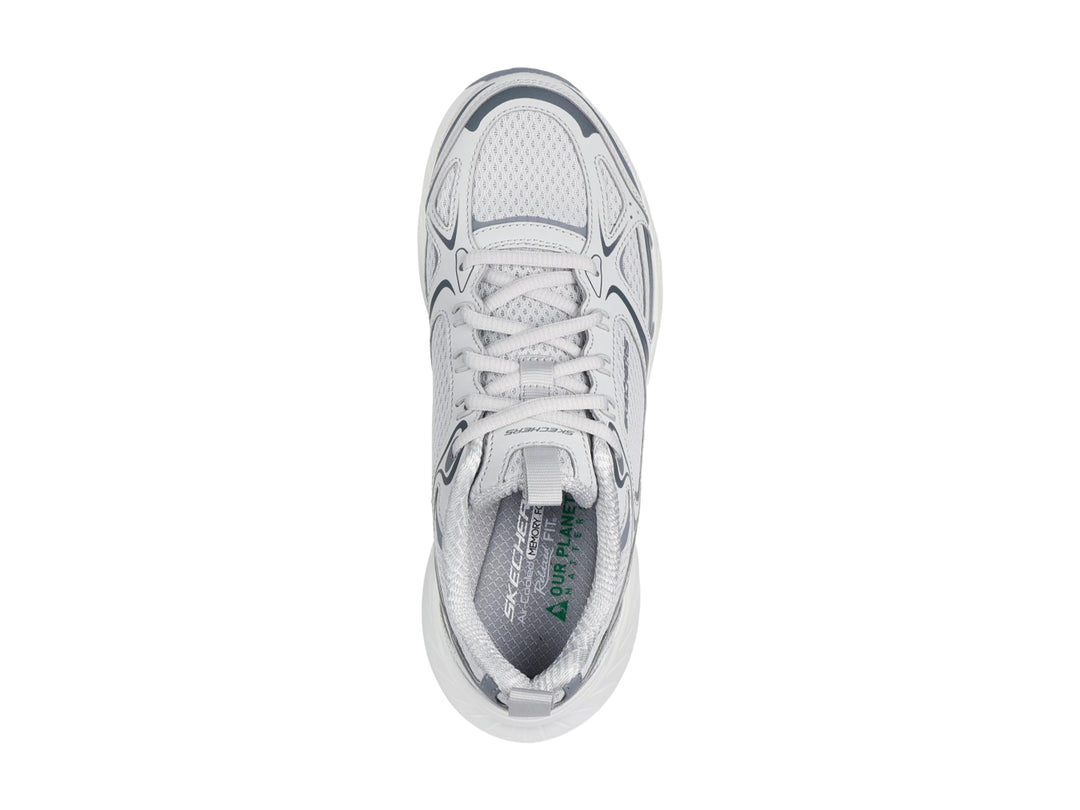 Tenis deportivos Skechers para mujer en color gris y blanco con suela blanca gruesa.