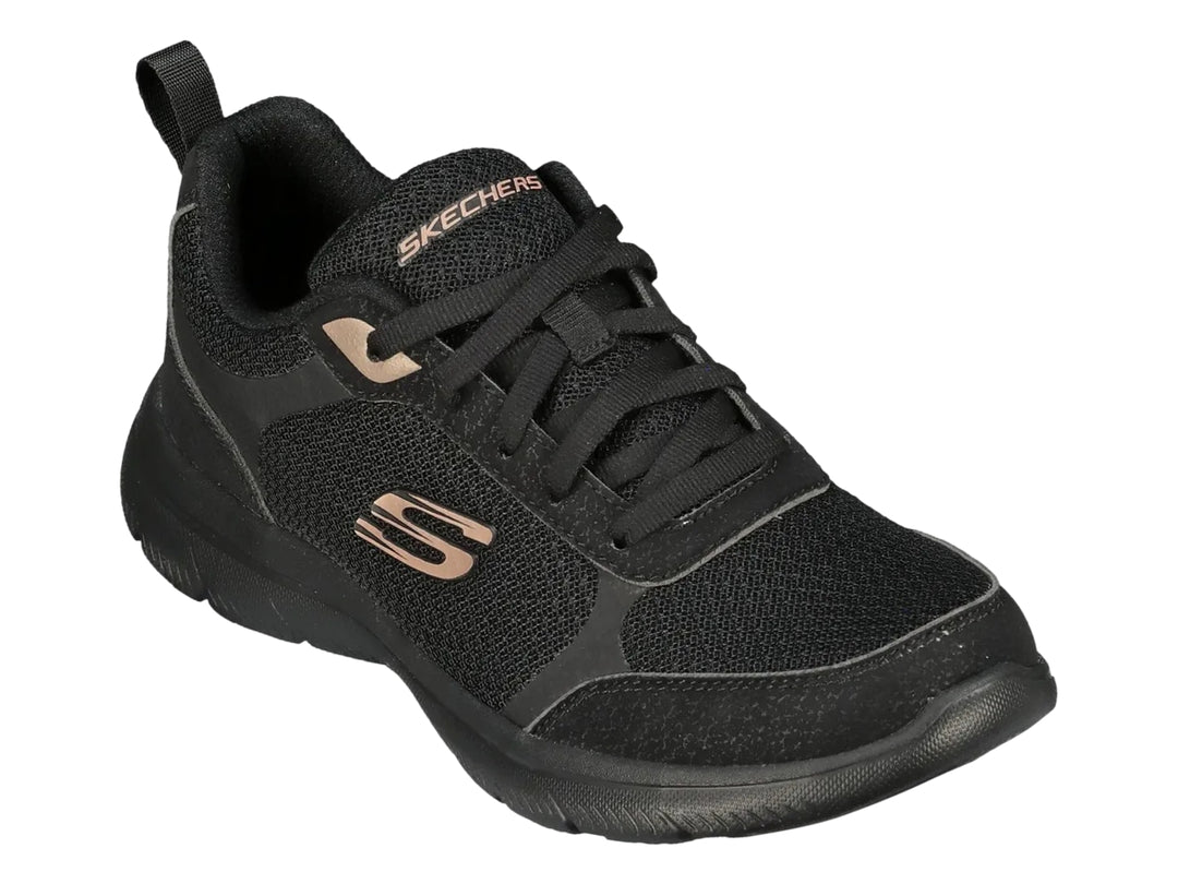 Tenis deportivos Skechers para mujer en color negro con suela flexible y detalles en tono cobre.