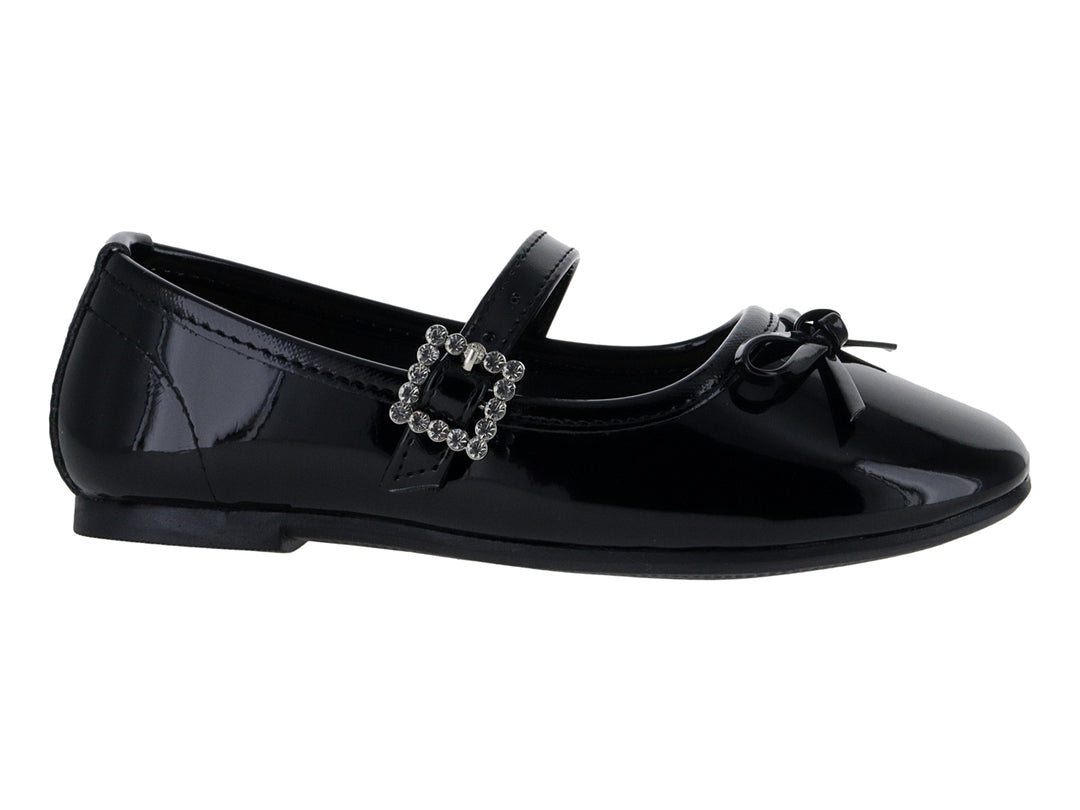 Zapato plano de charol negro para Niña con correa, hebilla brillante y moño decorativo.