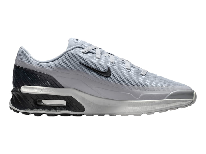 Tenis Nike Air Max color gris con detalles en negro y suela blanca.