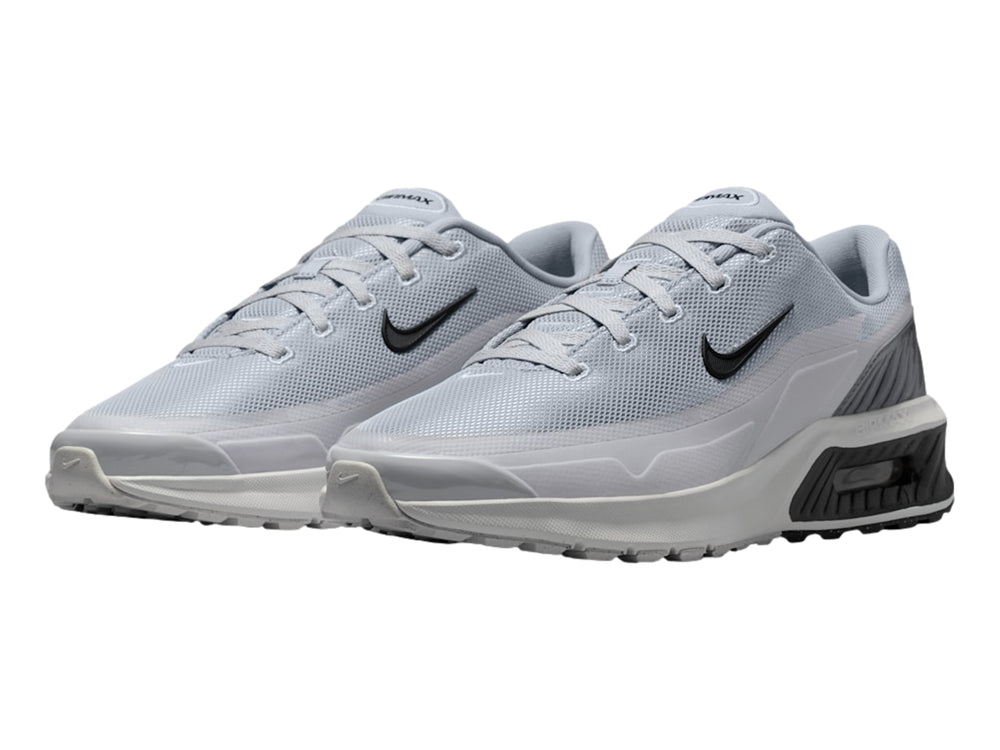 Tenis Nike Air Max color gris con detalles en negro y suela blanca.